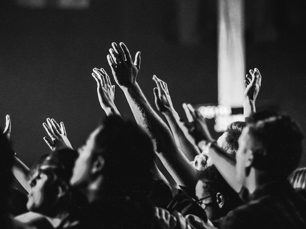 Photo by Shelagh Murphy: https://www.pexels.com/photo/grayscale-photo-of-people-raising-their-hands-1666816/